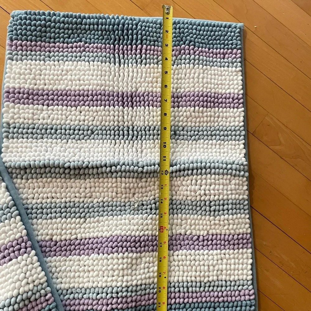 Two - rugs that are purple, white and blue